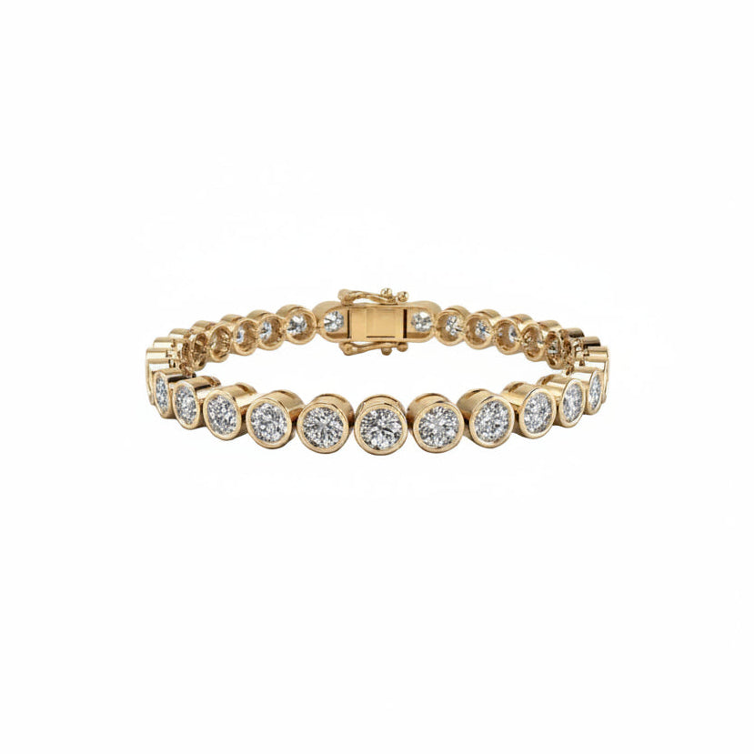 A yellow gold bezel set  bracelet featuring round-cut lab grown diamonds in bezel settings, displayed on a clean white background.