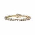 A yellow gold tennis bracelet featuring a row of round-shaped diamonds, displayed on a clean white background.
