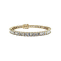 A yellow gold tennis bracelet featuring a row of baguette-cut diamonds, displayed against a solid white background.