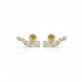 A pair of yellow gold stud earrings featuring marquise-cut, oval and round-cut diamonds, displayed on a clean white background.