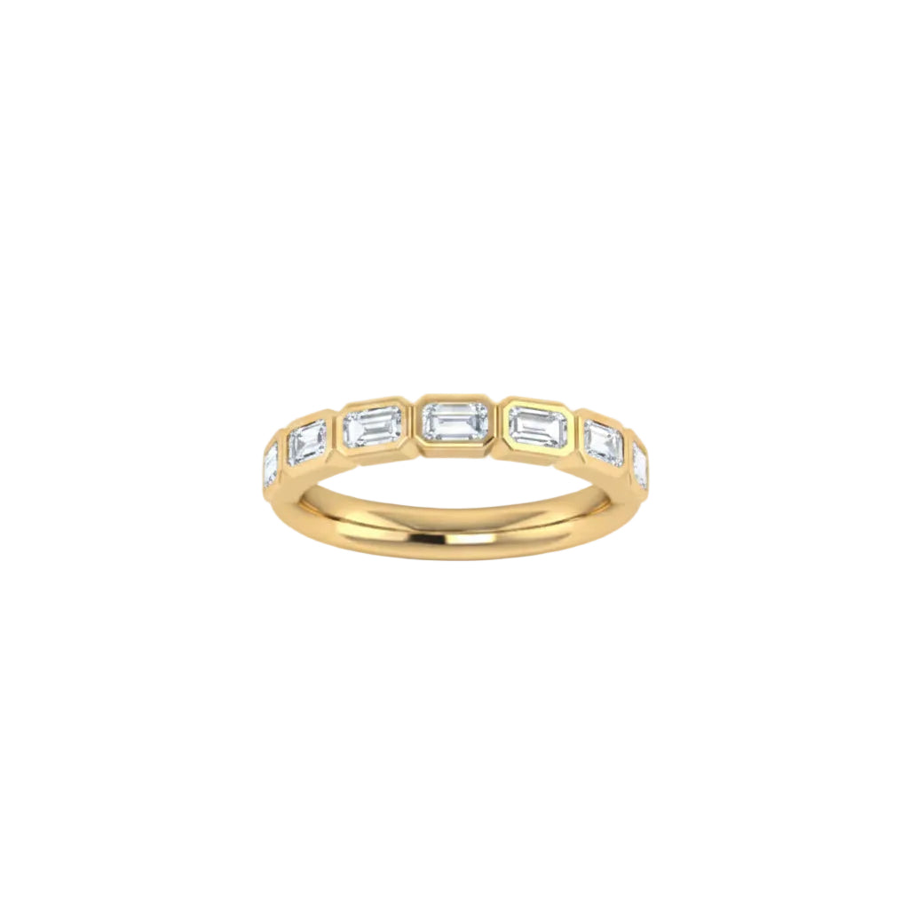 A yellow gold half eternity ring featuring a row of east-west set baguette-cut lab grown diamonds, shown on a plain white background.