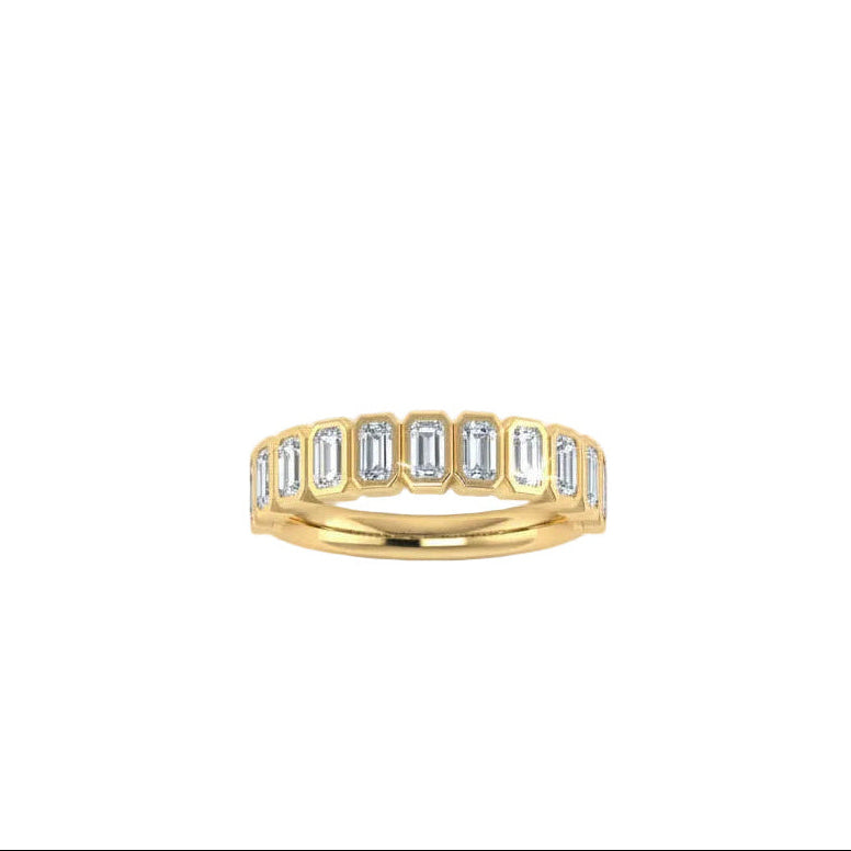 A yellow gold eternity ring featuring a row of baguette-cut diamonds, shown against a plain white background.