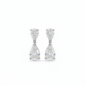 A pair of white gold drop earrings featuring two pear-cut diamonds, set against a plain white background.