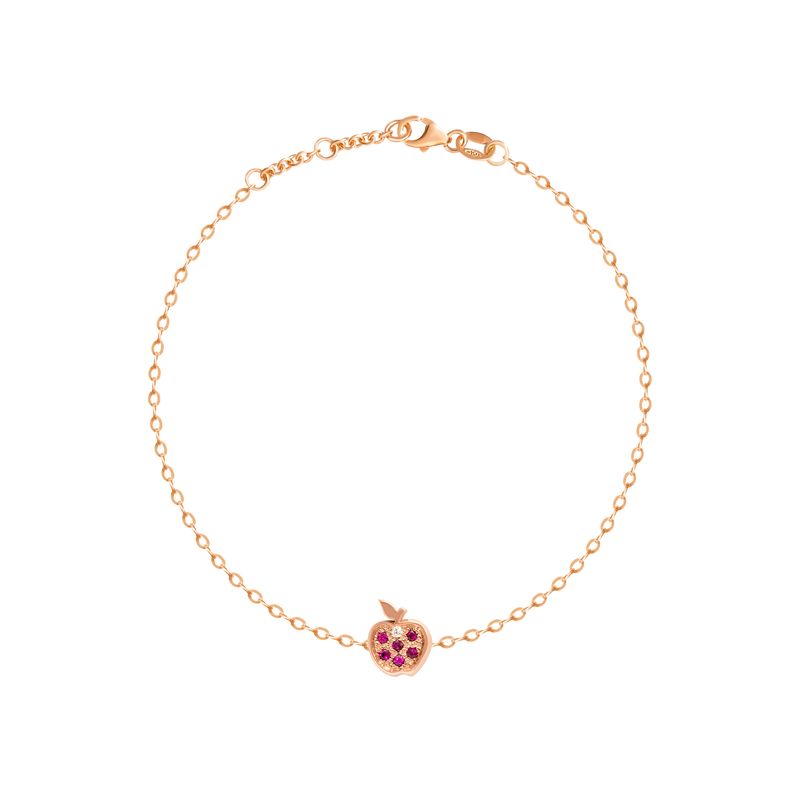 A delicate rose gold chain bracelet with a small apple charm featuring pink gemstone accents, displayed on a clean white background.