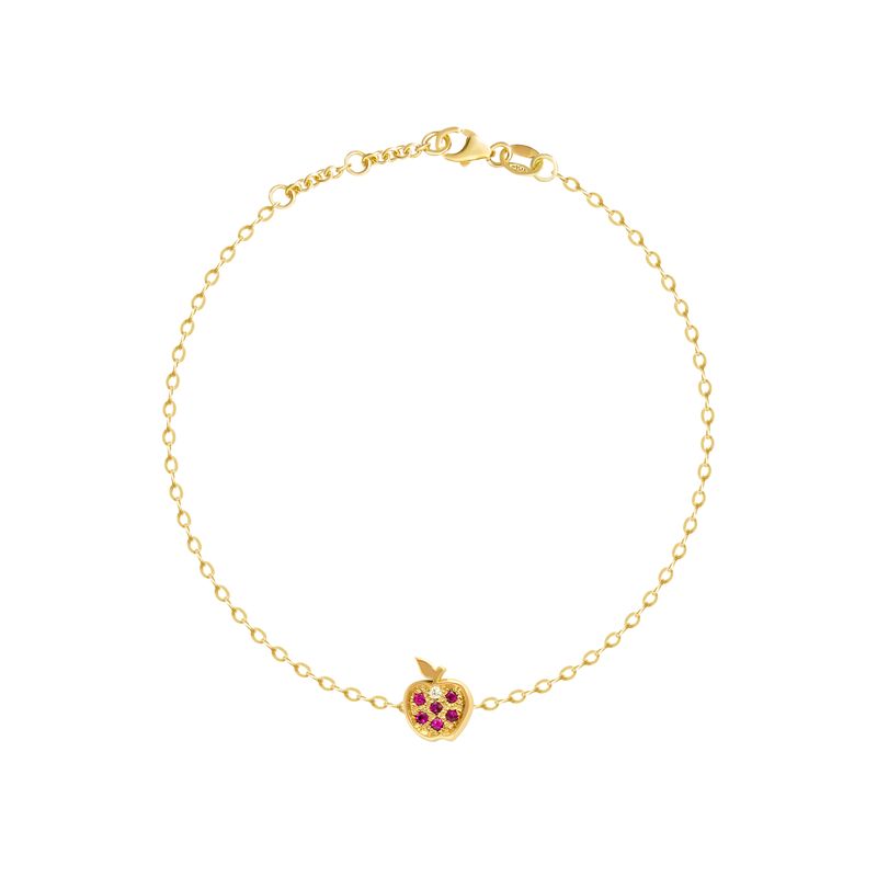 A delicate yellow gold chain bracelet with a small apple charm featuring red gemstone accents, displayed on a clean white background.