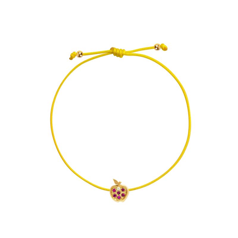 A yellow adjustable cord bracelet featuring a small gold charm shaped like an apple with purple gemstone accents, set against a plain white background.