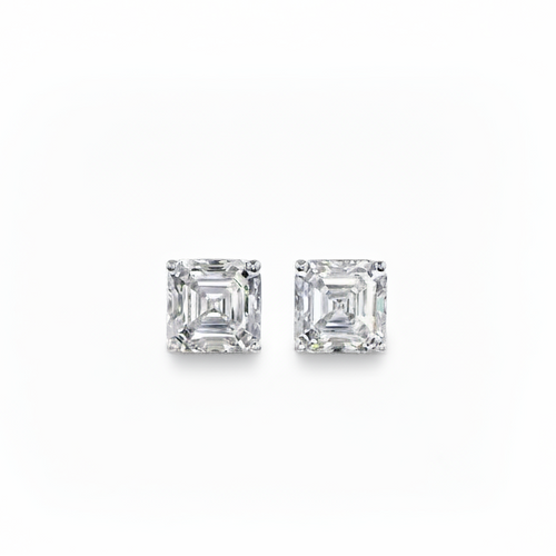 Pair of white gold asscher-shaped stud earrings on a white background