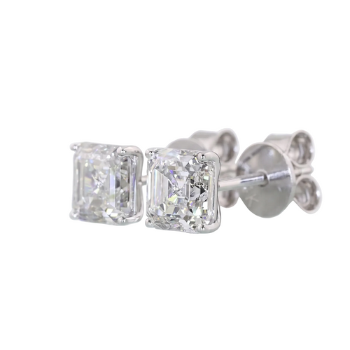 A pair of asscher stud diamond earrings in a white gold setting, shown against a plain white background.
