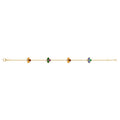 A delicate gold chain bracelet featuring four small clover motifs in different colors (orange, green, yellow, purple) spaced evenly along the chain, set against a plain white background.