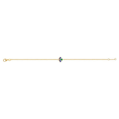 A delicate yellow gold chain bracelet featuring a central clover motif. The left and right clover petals are set with pear cut blue gemstones, while the center petal is set with a vibrant green color and a round diamond at the top.