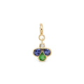 A yellow gold charm pendant featuring three flower-like stones in blue, green gemstones with a small clear round diamond above them, set against a plain white background.