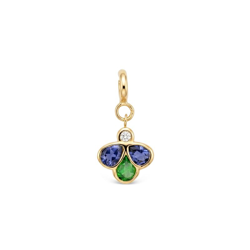 A yellow gold charm pendant featuring three flower-like stones in blue, green gemstones with a small clear round diamond above them, set against a plain white background.