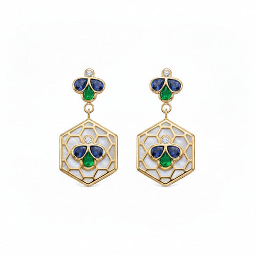 A pair of gold drop earrings featuring a hexagonal openwork design with white inlay, accented by blue and green enamel-like sections and a small round diamond at the top.
