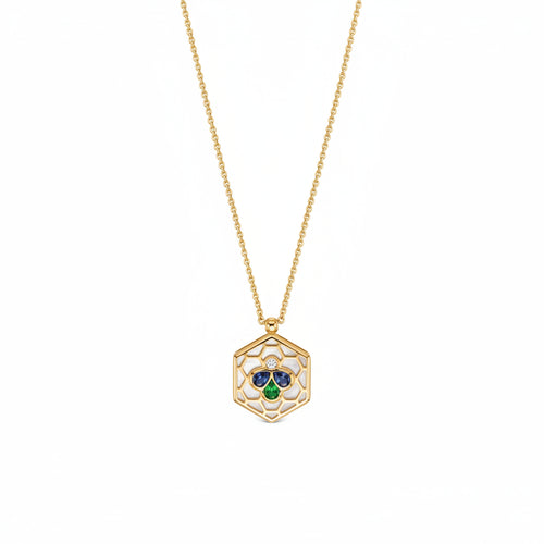 A gold chain necklace with a hexagonal pendant featuring a white center, a small clear stone, and a three-stone clover motif in blue, green, and gold.