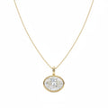 A yellow gold necklace with a oval bezel east-west set diamond, shown against a plain white background.

