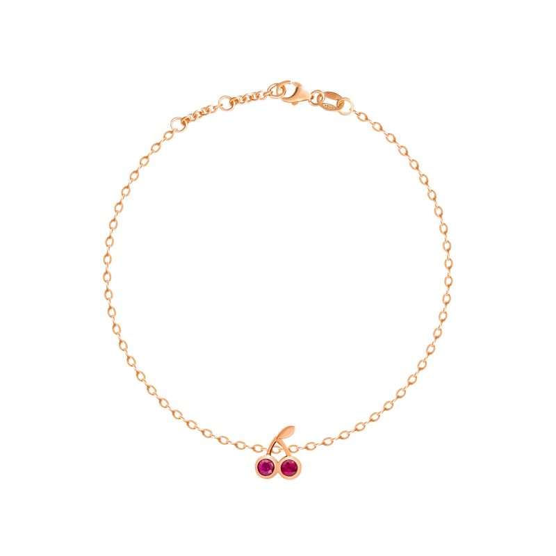 A delicate rose gold chain bracelet with a cherry charm featuring two red gemstones and a small clear accent stone, displayed on a clean white background.