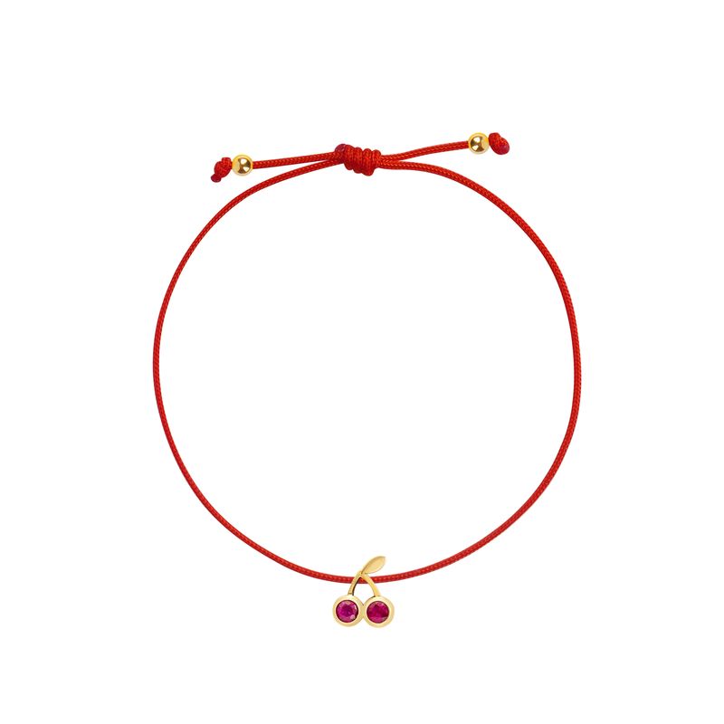 A red adjustable cord bracelet featuring a small gold-toned watermelon slice charm embellished with pink gemstones, shown on a plain white background.
