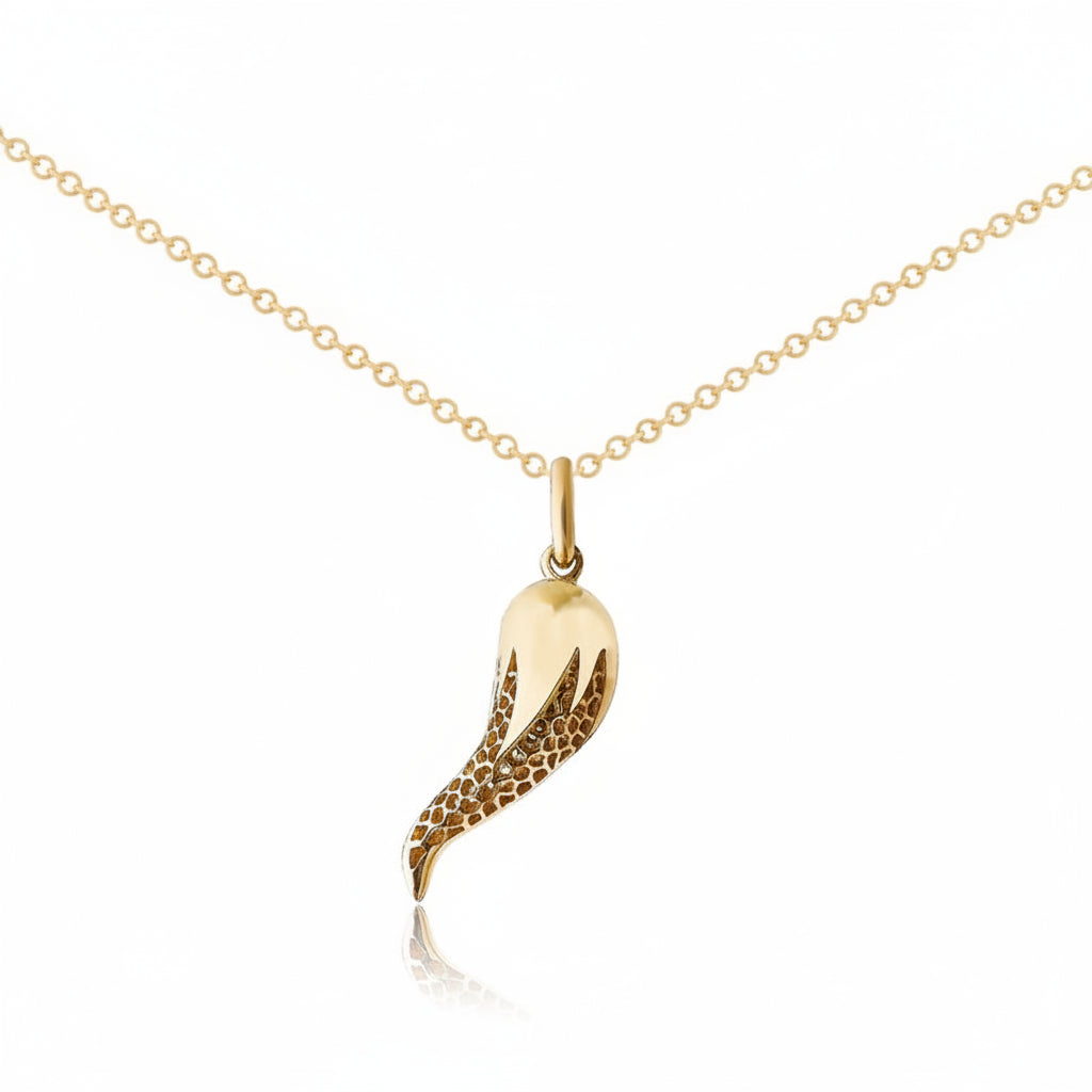 A gold pendant necklace featuring a stylized Horn with a textured, honeycomb-patterned lower section and a smooth, polished upper section, suspended from a delicate gold chain against a white background.