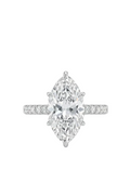A Platinum ring featuring a large marquise-cut center stone in a prong setting, with a pavé band accented by small round stones, shown on a plain white background.
