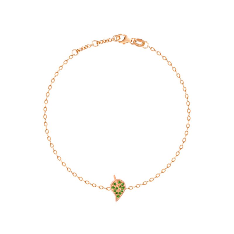 A delicate rose gold chain bracelet with a small leaf-shaped charm paved with green stones, displayed on a clean white background.