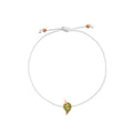 A delicate white cord bracelet featuring a small leaf- shaped charm with green stones and a rose gold border, displayed on a clean white background.