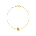 A delicate yellow gold chain bracelet with a small round pavé-set gold lemon charm, displayed on a clean white background.