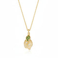 Yellow gold diamond and gemstone lemon design pendant on a white background.