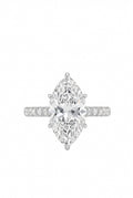 A silver-tone ring featuring a large marquise-cut clear gemstone in a six-prong setting, with a pavé band accented by small round diamonds, shown on a plain white background.
