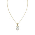 18k white gold solitaire pendant necklace featuring a 2.00 carat oval lab diamond in a four-prong setting. A yellow gold necklace with a single solitaire oval diamond pendant, displayed against a solid white background.