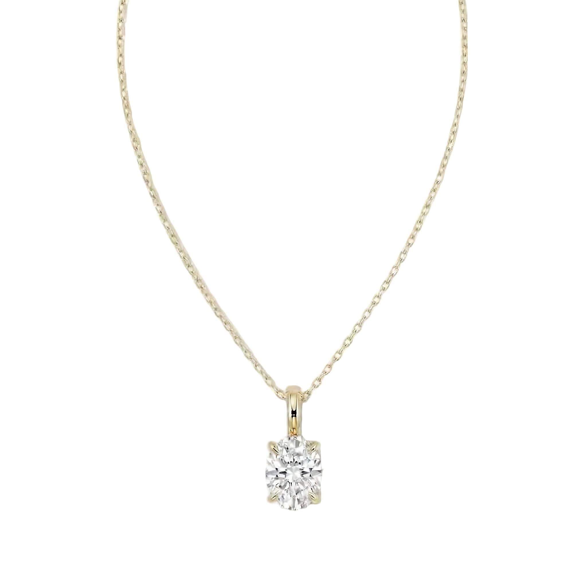 18k white gold solitaire pendant necklace featuring a 2.00 carat oval lab diamond in a four-prong setting. A yellow gold necklace with a single solitaire oval diamond pendant, displayed against a solid white background.