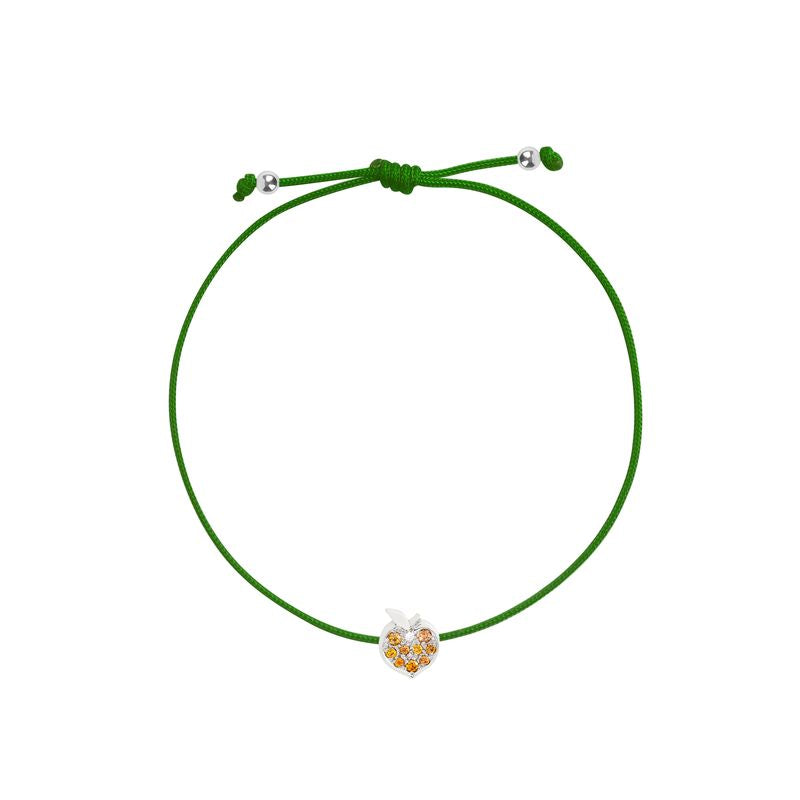 A green adjustable cord bracelet featuring a small apple-shaped charm with white gold and orange details, displayed on a clean white background.