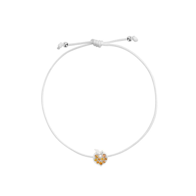 A white adjustable cord bracelet featuring a small apple-shaped charm with white gold and orange details, displayed on a clean white background.