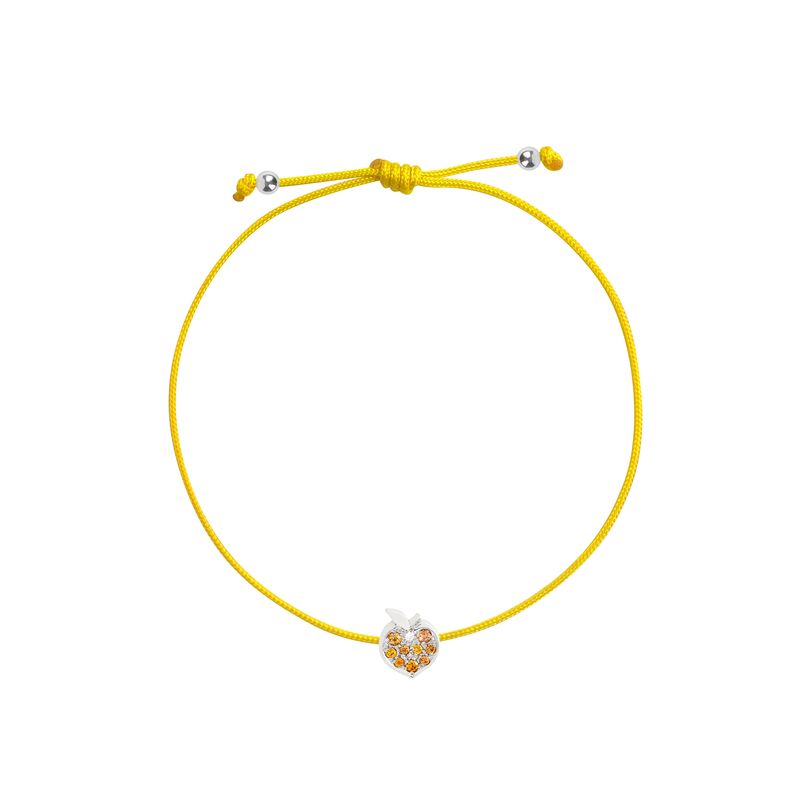 A yellow adjustable cord bracelet featuring a small apple-shaped charm with white gold and orange details, displayed on a clean white background.