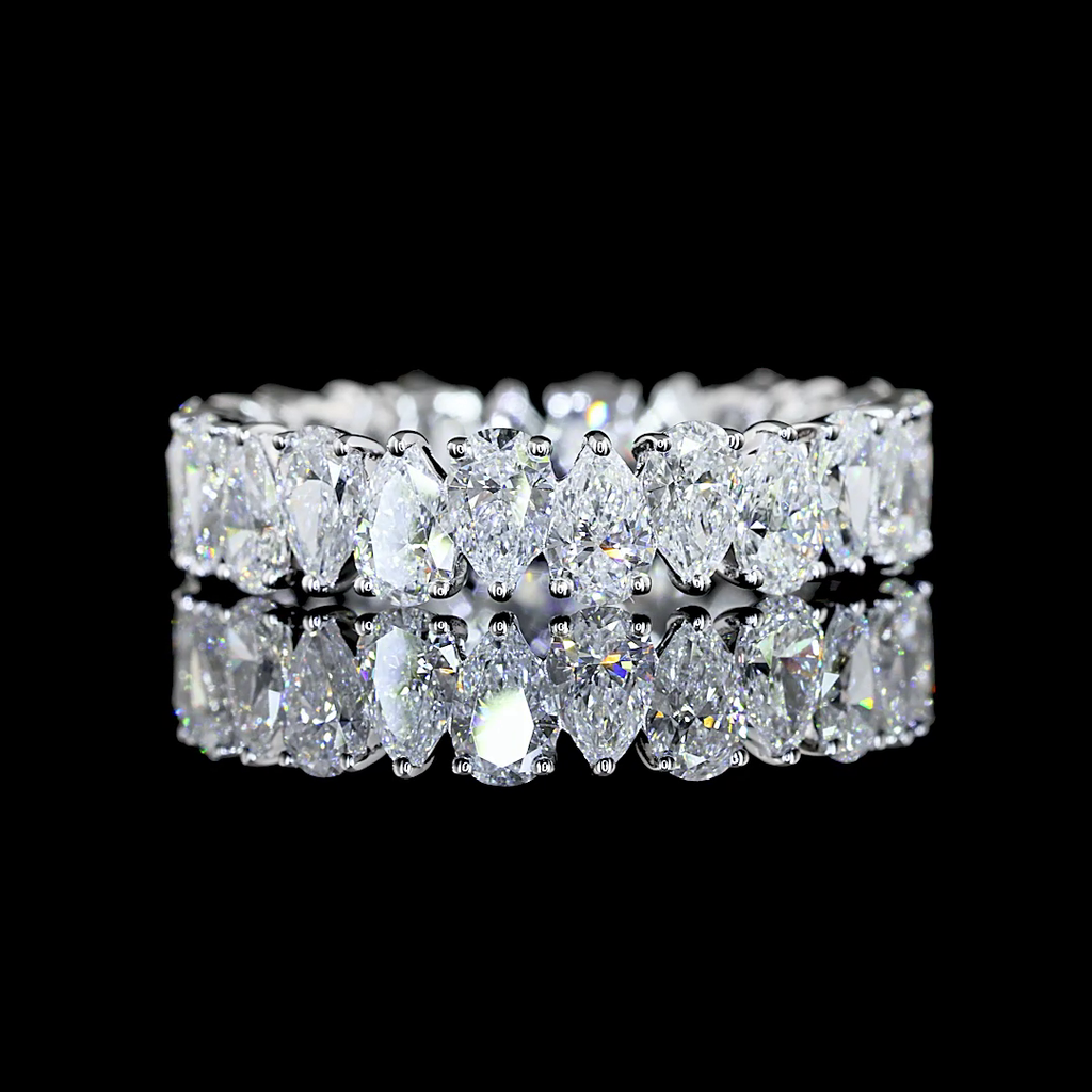 A white gold Pear Diamond Prong set full eternity ring featuring a continuous row of pear cut lab grown diamonds, shown on a clean black background.