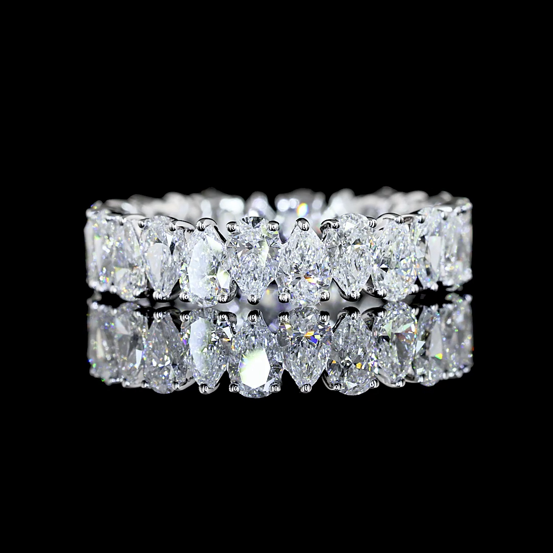 A white gold Pear Diamond Prong set full eternity ring featuring a continuous row of pear cut lab grown diamonds, shown on a clean black background.