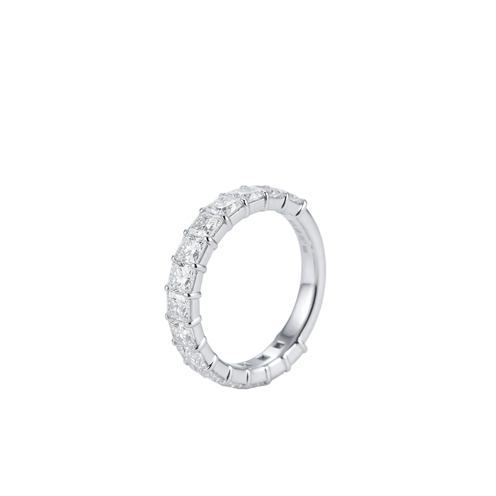 A white gold eternity ring featuring a  3/4 around the band, row of radiant-cut lab grown diamonds in a prong setting, shown on a plain white background.