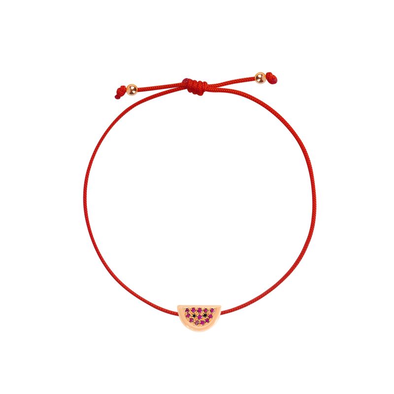 A red adjustable cord bracelet featuring a small gold-toned watermelon slice charm embellished with pink gemstones, shown on a plain white background.