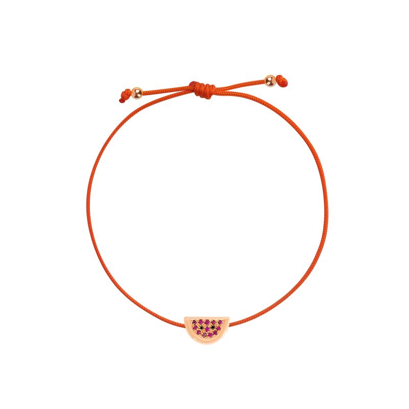 An orange adjustable cord bracelet featuring a small gold-toned watermelon slice charm embellished with pink and purple rhinestones, shown on a plain white background.