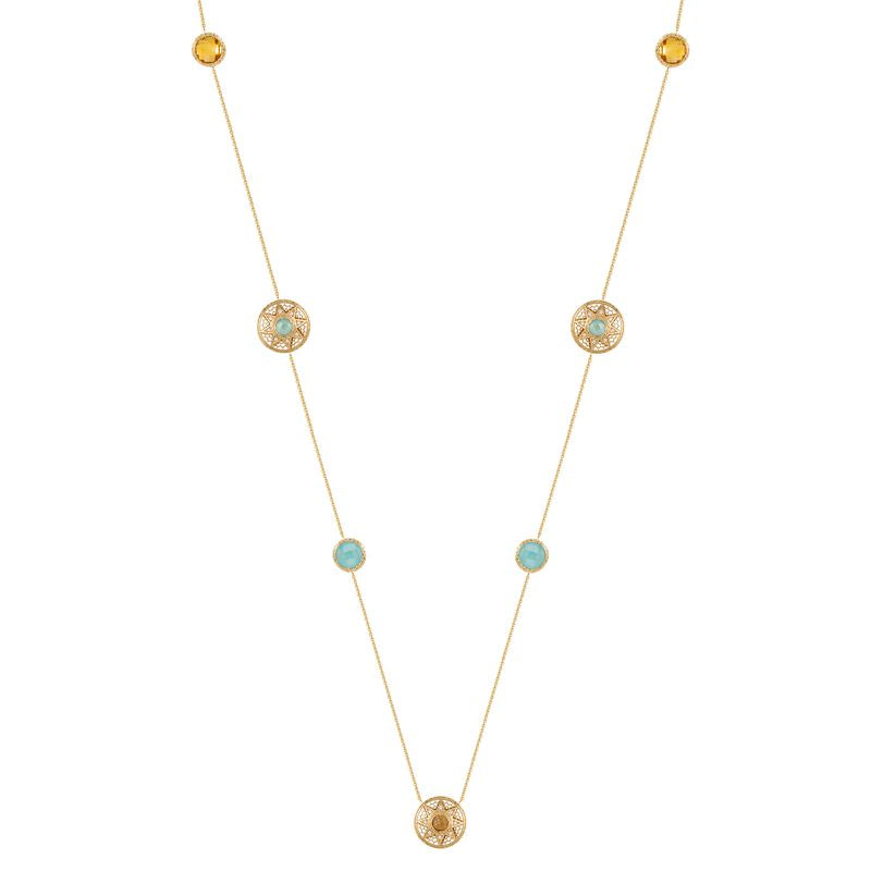 A delicate gold necklace featuring multiple small circular gold ornaments, some with tiny light blue stones and others with textured yellow center stones, displayed on a clean white background.