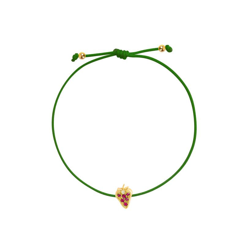 An adjustable green cord bracelet featuring a small yellow gold strawberry charm embellished with red gemstones, displayed on a clean white background.