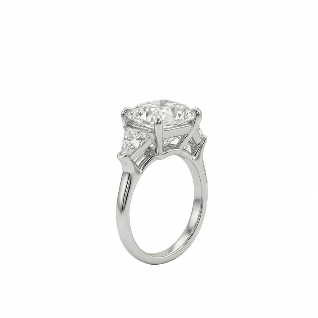 18k white gold three stone ring featuring 7 carat square cushion lab diamond flanked by trillion side stones shown from the side view on white background.