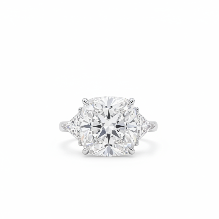 Cushion Cut Diamond And Trillion diamonds on the side - Three Stone Ring in White Gold on a white background.