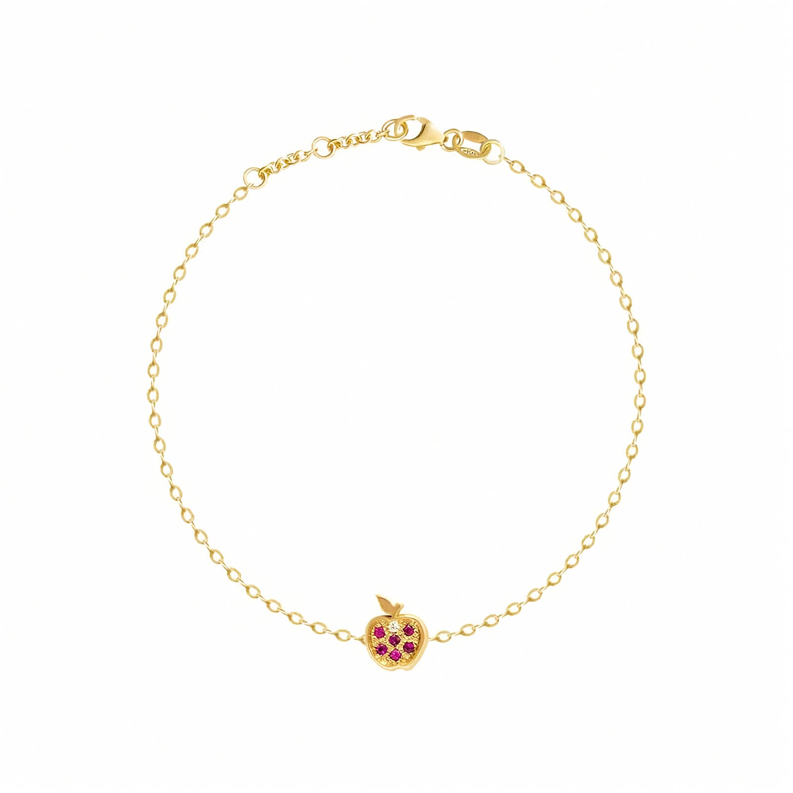 Rosmundo collaboration 18k gold apple chain bracelet with natural rubies and diamond. A delicate yellow gold chain bracelet with a small apple charm featuring red gemstone accents, displayed on a clean white background.
