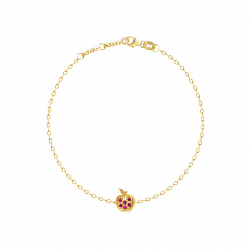 Rosmundo collaboration 18k gold apple chain bracelet with natural rubies and diamond. A delicate yellow gold chain bracelet with a small apple charm featuring red gemstone accents, displayed on a clean white background.