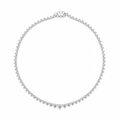 A delicate graduated, three prong  tennis necklace in white gold with small round dimonds, arranged in a circle on a plain white background.