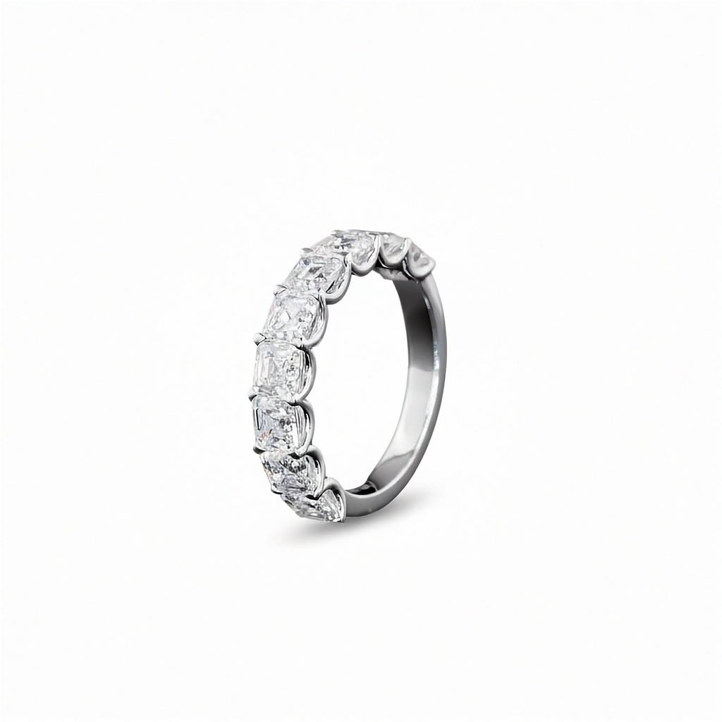 A white gold Asscher Diamond Prong set 1/2 eternity ring featuring a continuous row of asscher cut lab grown diamonds, shown on a clean white background.