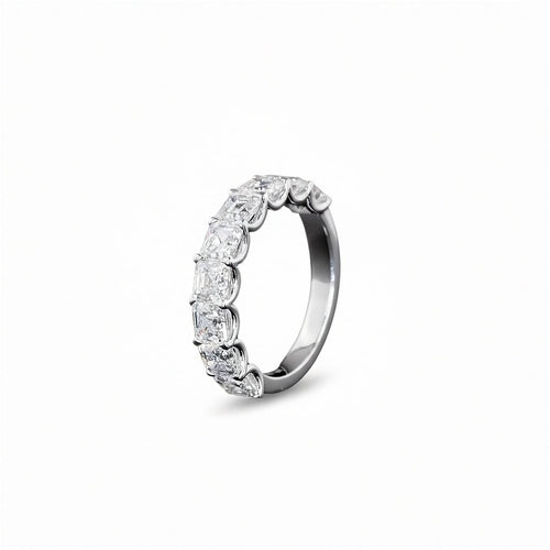A white gold Asscher Diamond Prong set 1/2 eternity ring featuring a continuous row of asscher cut lab grown diamonds, shown on a clean white background.