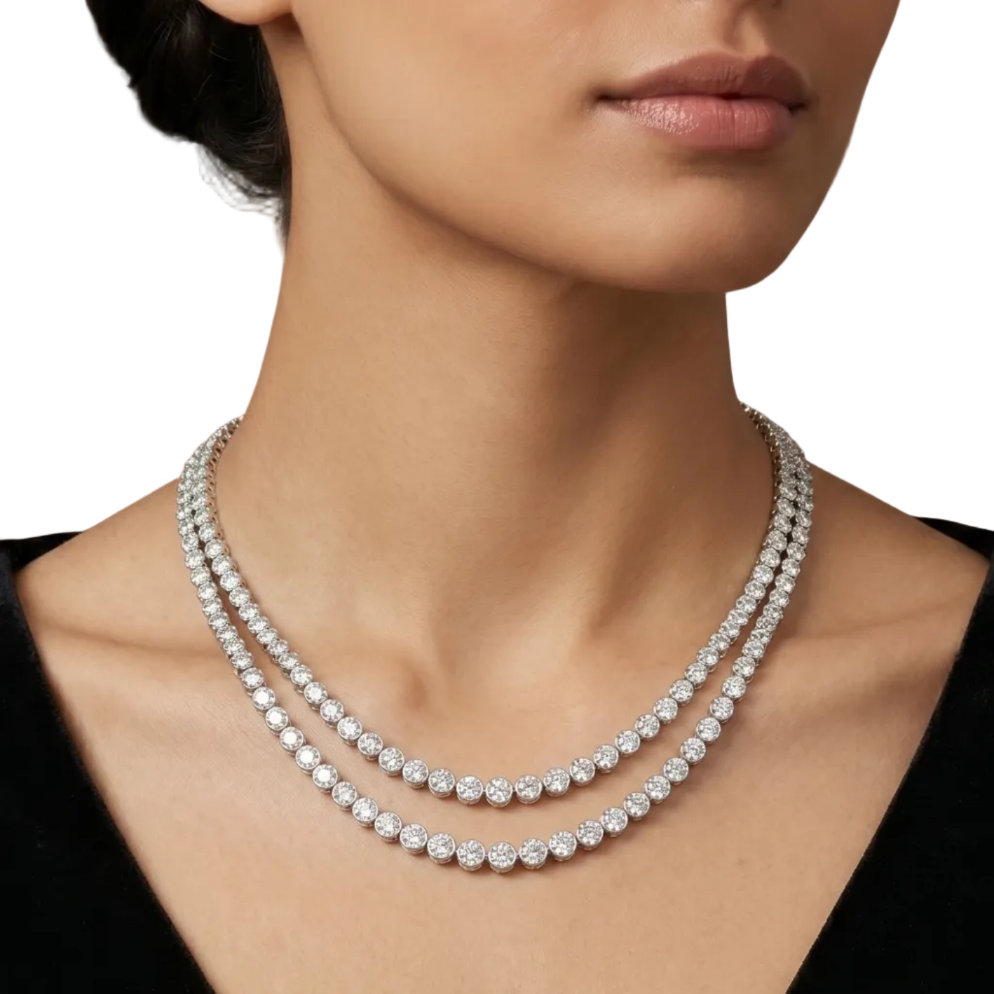 A double-strand tennis necklace featuring clear round-cut stones in a white gold setting, displayed on a model.