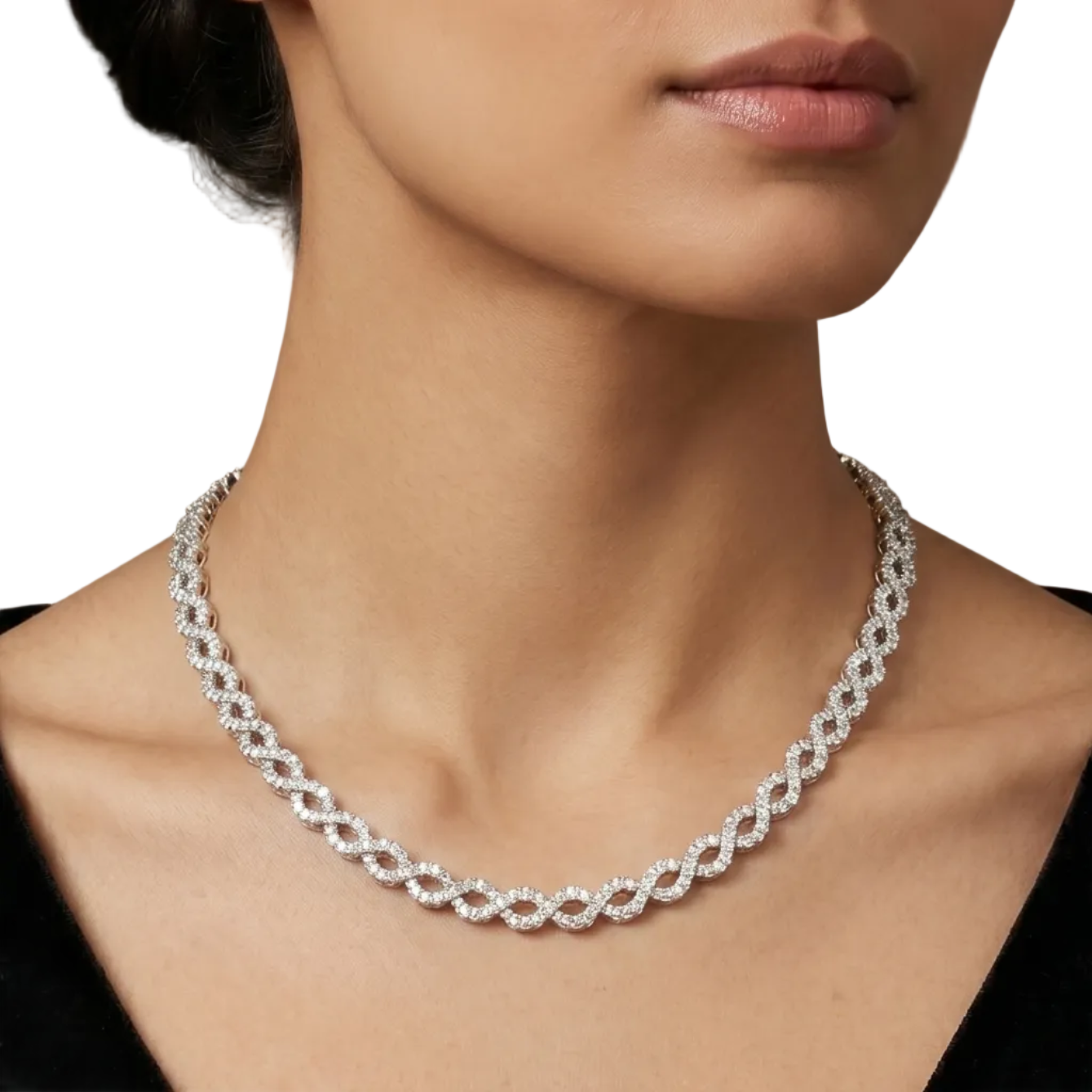A gold chain necklace with a double row of sparkling clear pavé-set round diamonds in oval shaped design, displayed on a model.