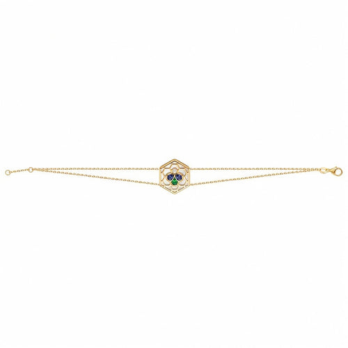 Bee Icon 18k yellow gold station bracelet with iolite, tsavorite, mother of pearl, and diamond set against a plain white background.